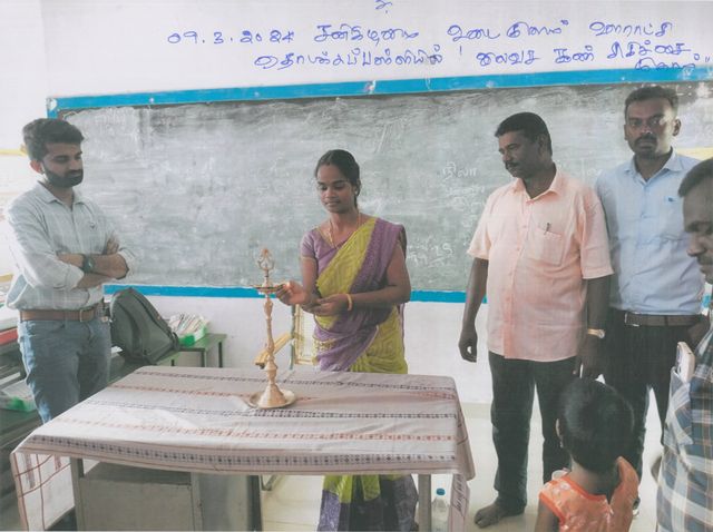 Lamp lighting ceremony with trust members and guests