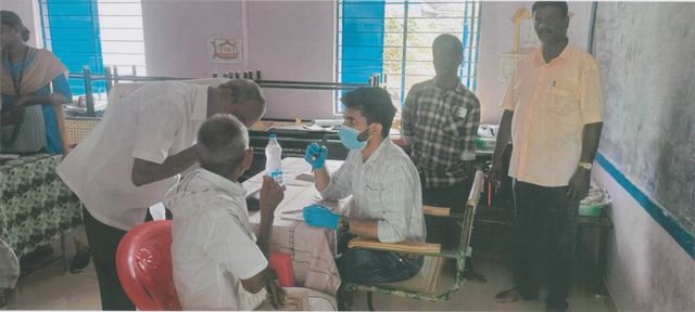 Doctor examining a patient at an eye check-up camp