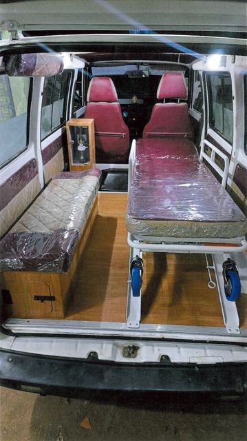 Ambulance interior with stretcher and seats